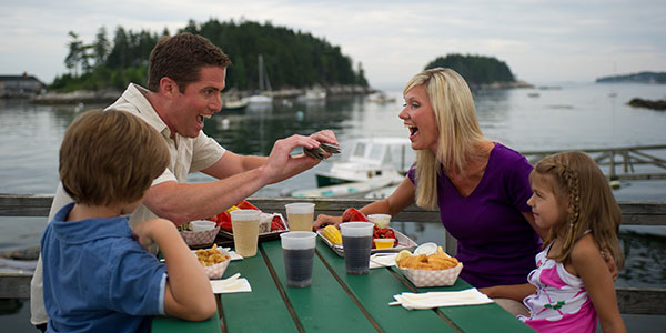 Summer in Maine - Family Eating Clams Outdoors - Photo Credit Maine Office of Tourism